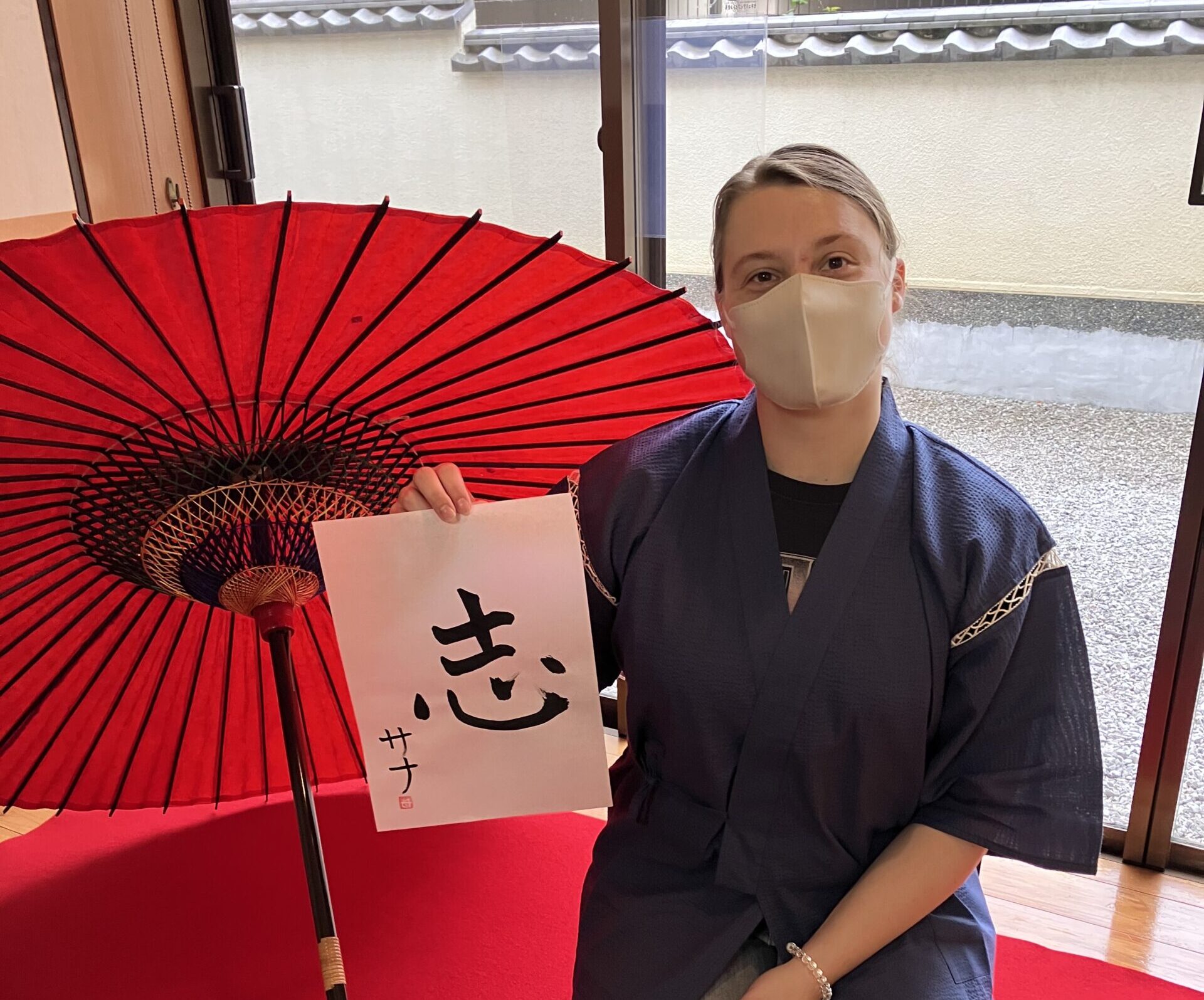 A photo of one of the gusts with her calligraphy work.