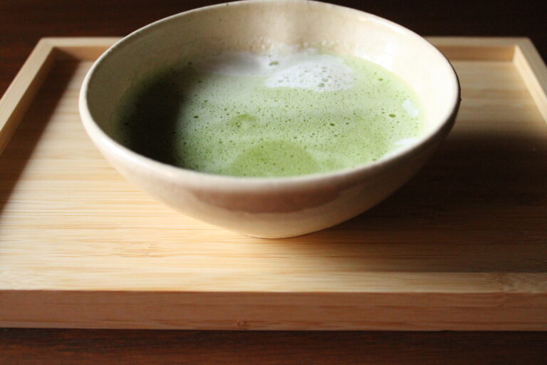 A photo of a cup of matcha latte.