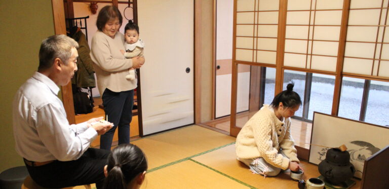 A photo of our guests enjoying practice of tea ceremony.