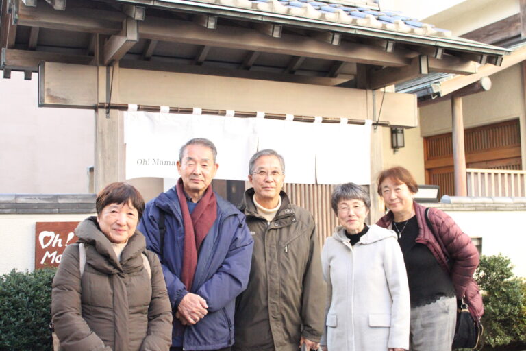 A group photo of our guests at the front gate.