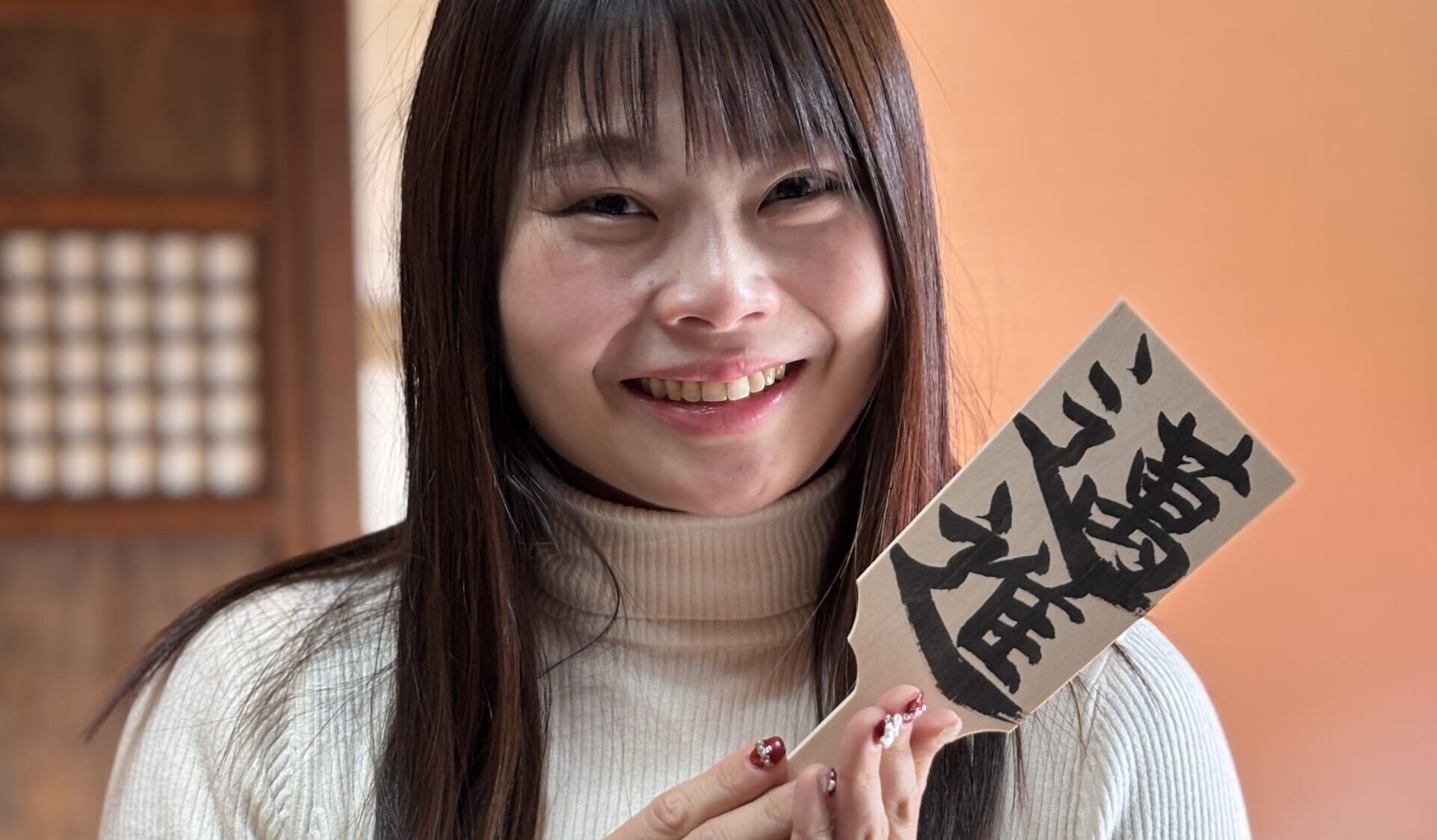 A photo of our guest with her hand written calligraphy.