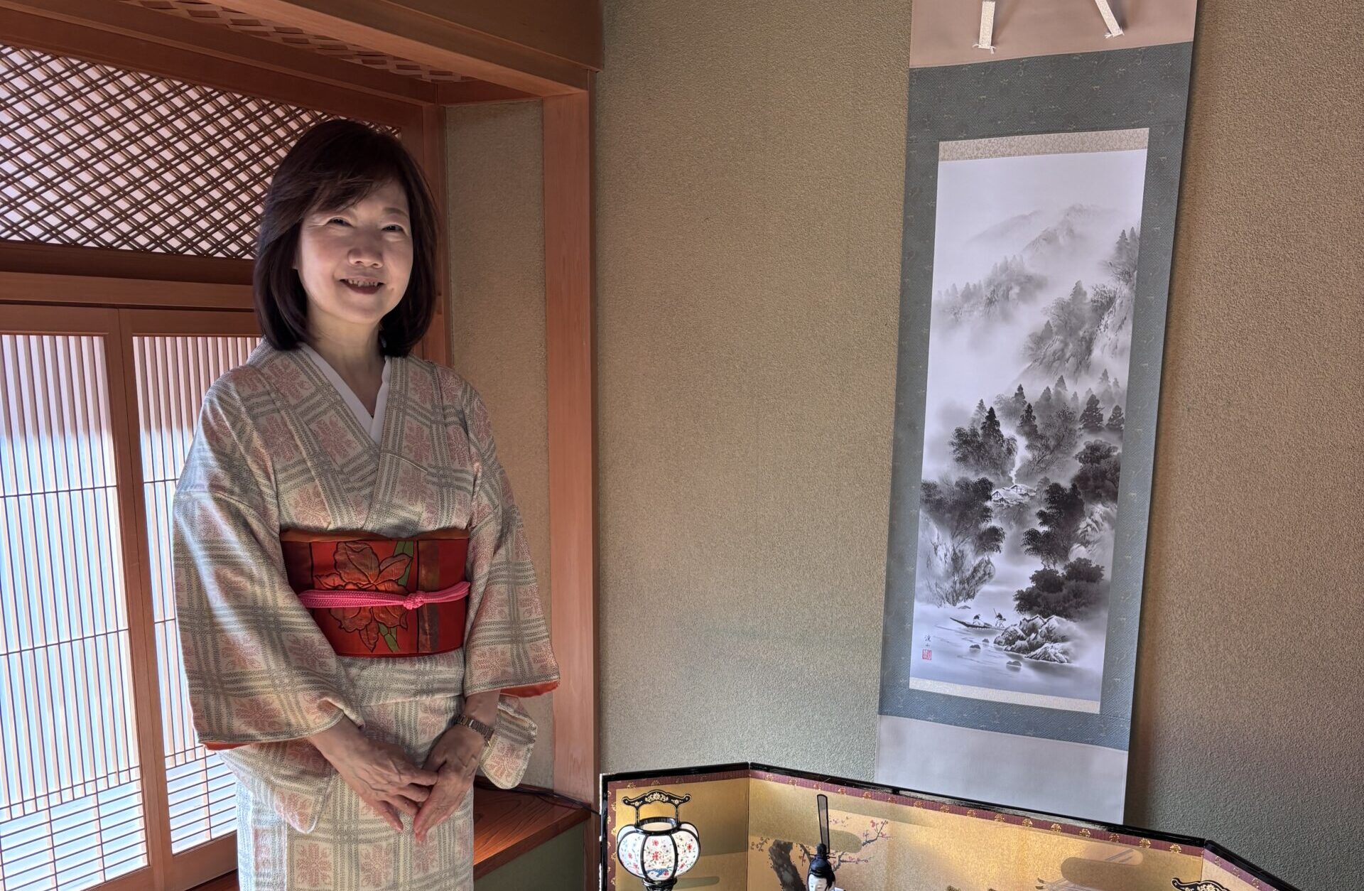 A photo of a woman wearing kimono.