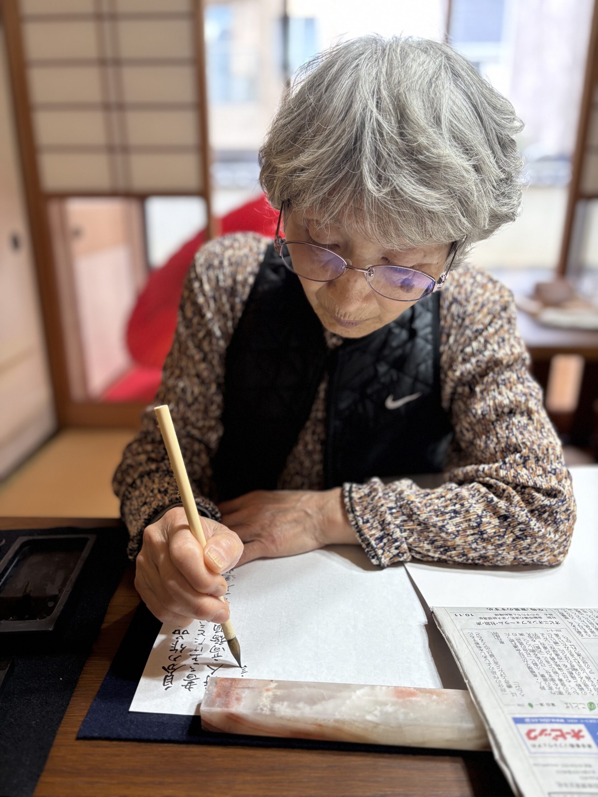 A photo of our guest enjoying the calligraphy.