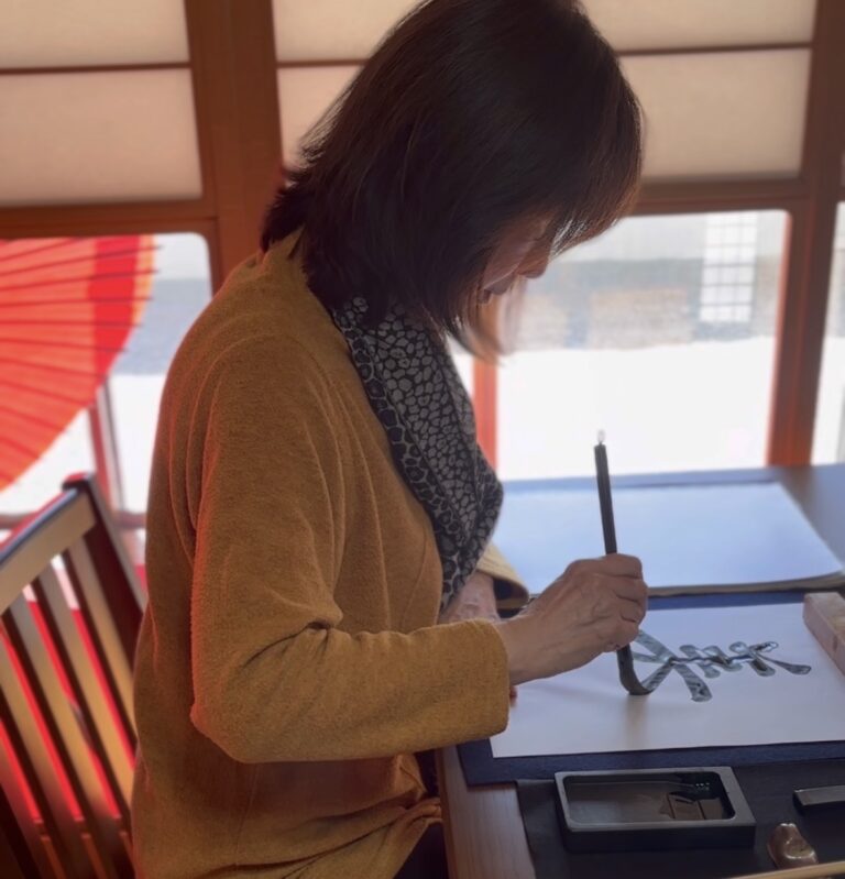 A photo of a guest enjoying the calligraphy.