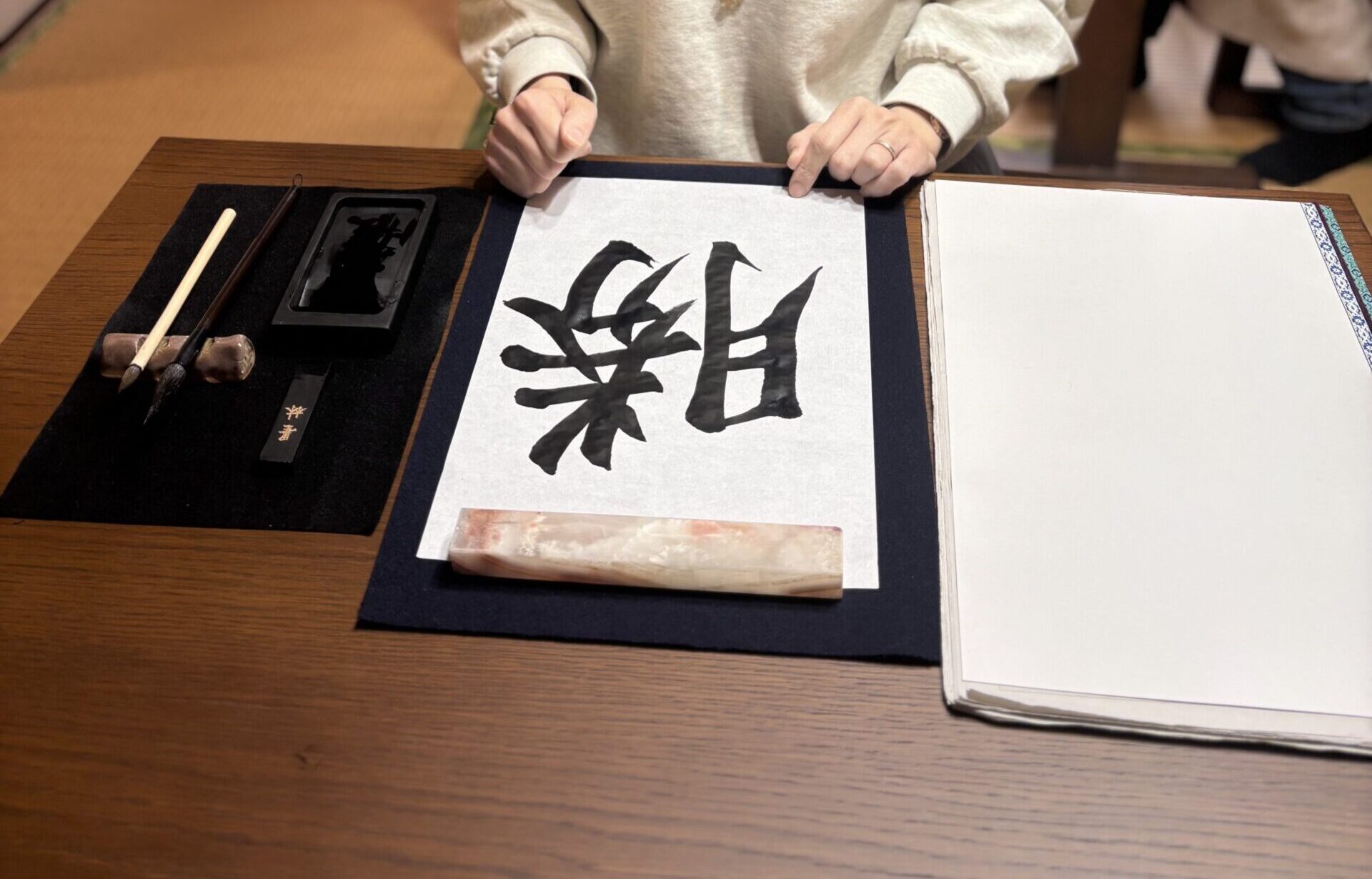 A photo of our guest enjoying calligraphy.