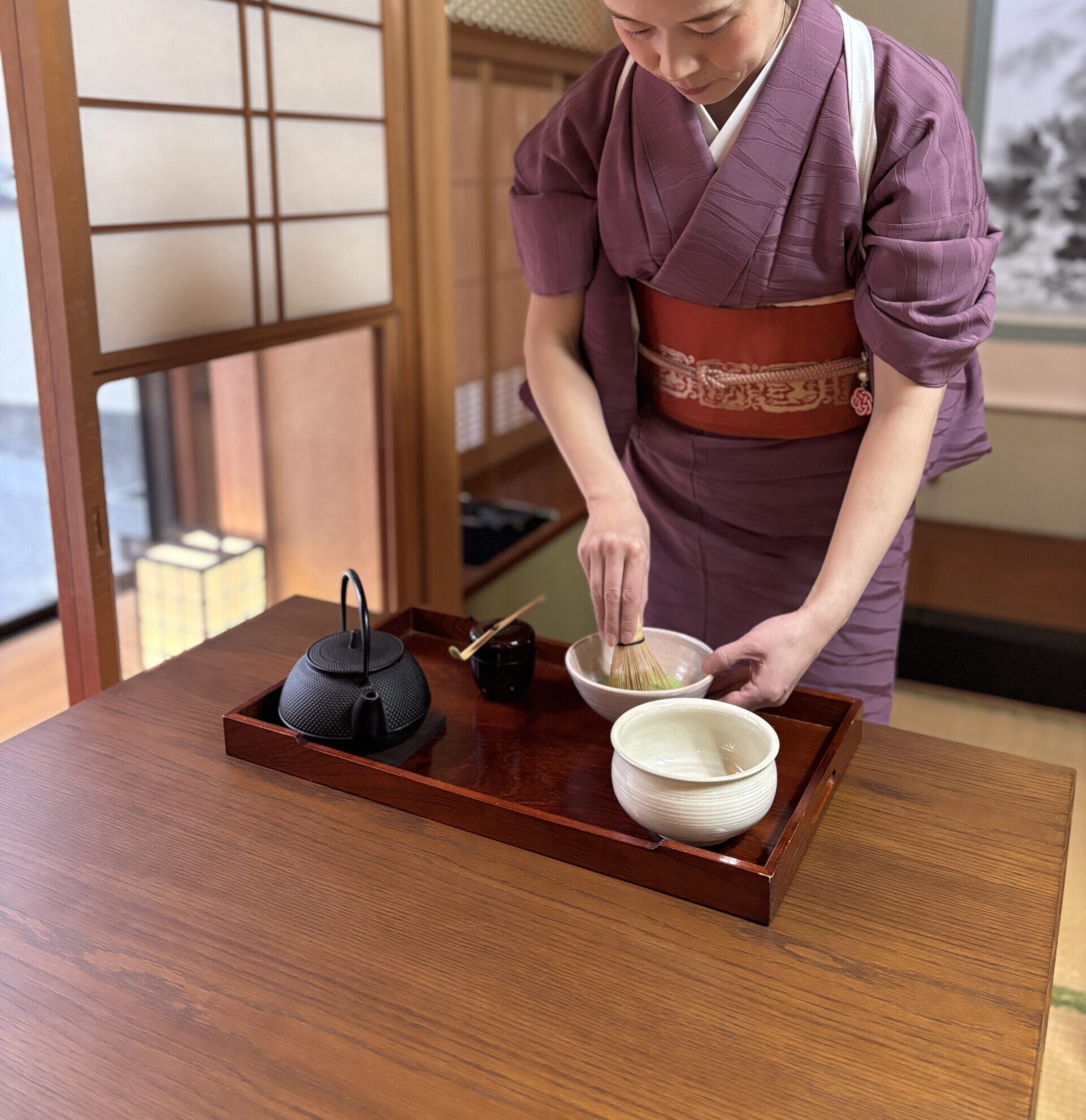 A photo of matcha being prepared at the table.