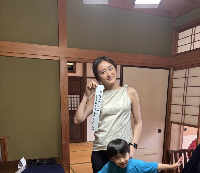 A photo of our guests with the special Tanabata calligraphy.