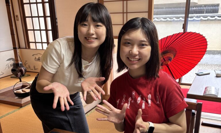 A photo of our guests with the calligraphy work; Tokyo.
