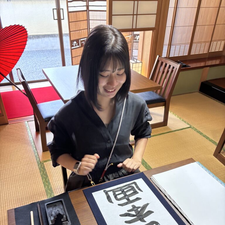 A photo of our guest enjoying the calligraphy.