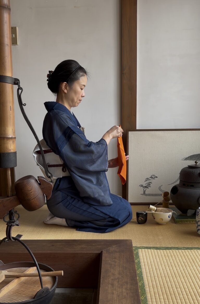 A photo of the manager preparing some matcha in the tea ceremony.