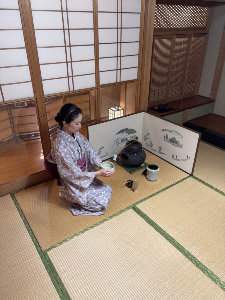 The manager prepares a cup of matcha in the tea ceremony.