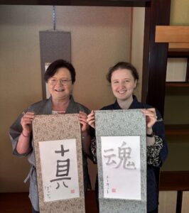 A photo of a customer showing their calligraphy work.