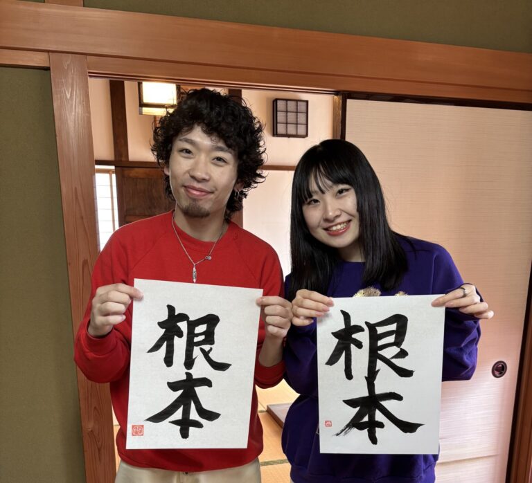 A photo of our guests showing their calligraphy work.