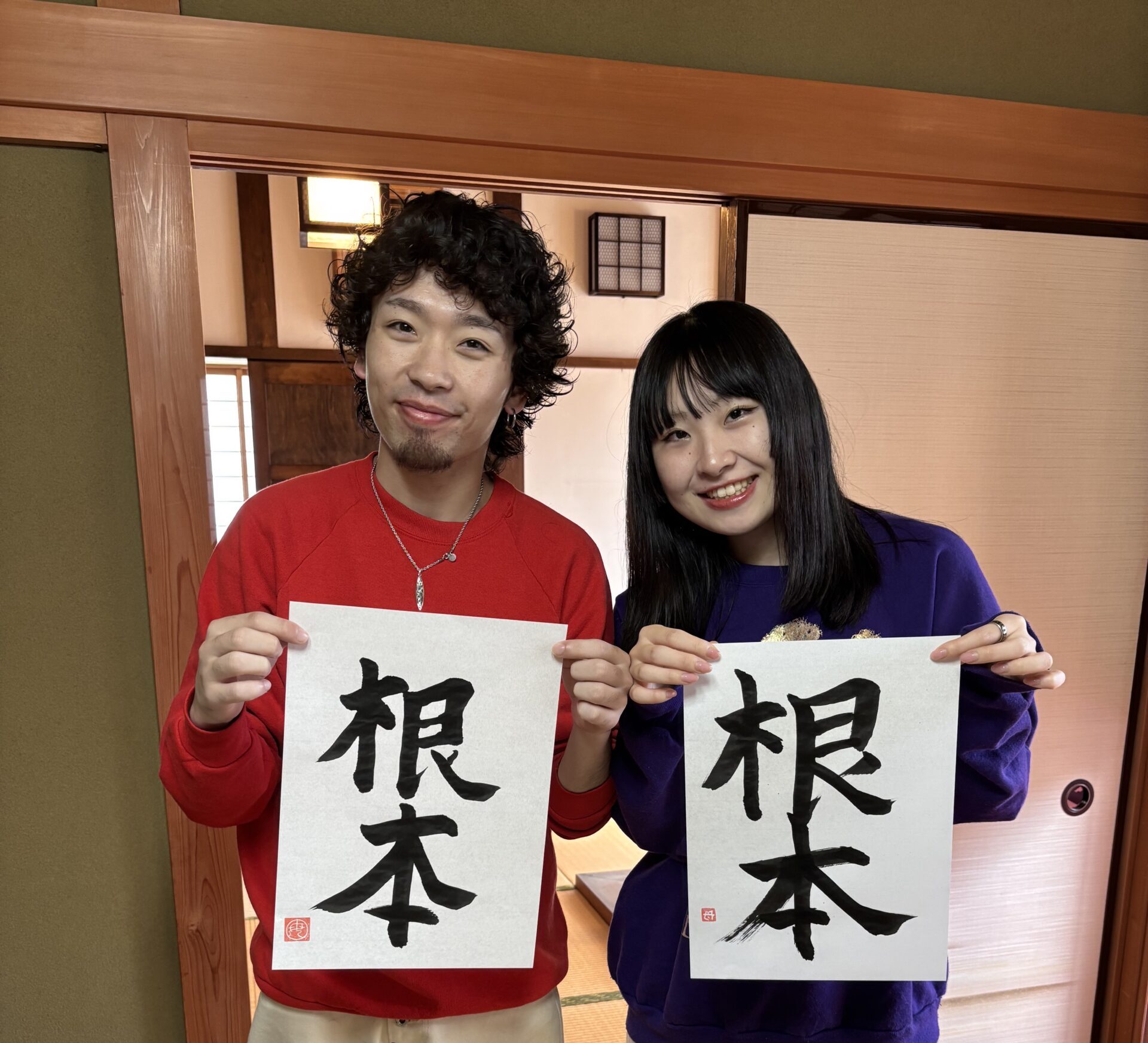 A photo of our guests showing their calligraphy work.