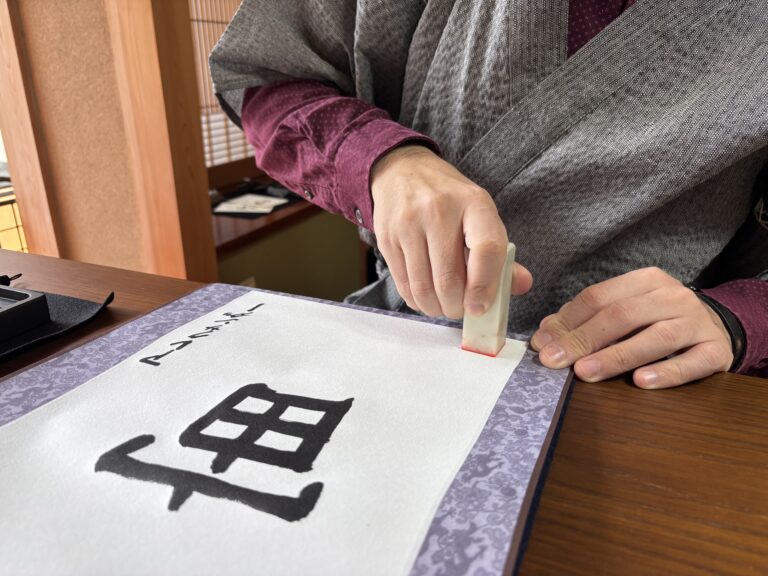 A photo of stamping the seal, hanko.