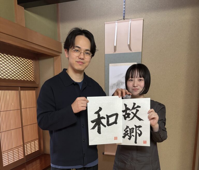 Our guests showing their calligraphy pieces.