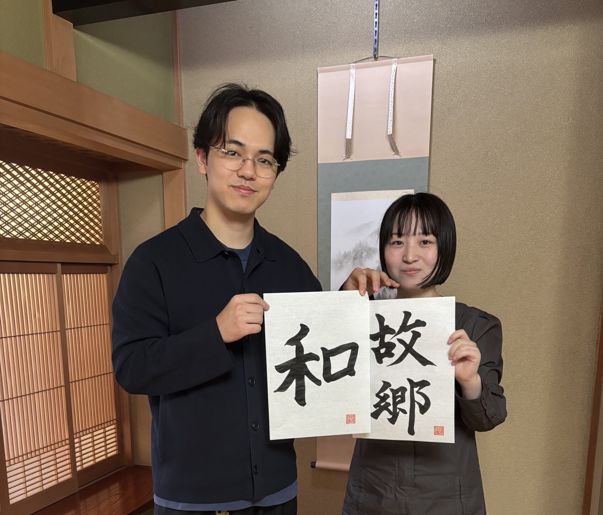 Our guests showing their calligraphy pieces.