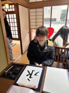 Our guest with his calligraphy piece "Eternity".