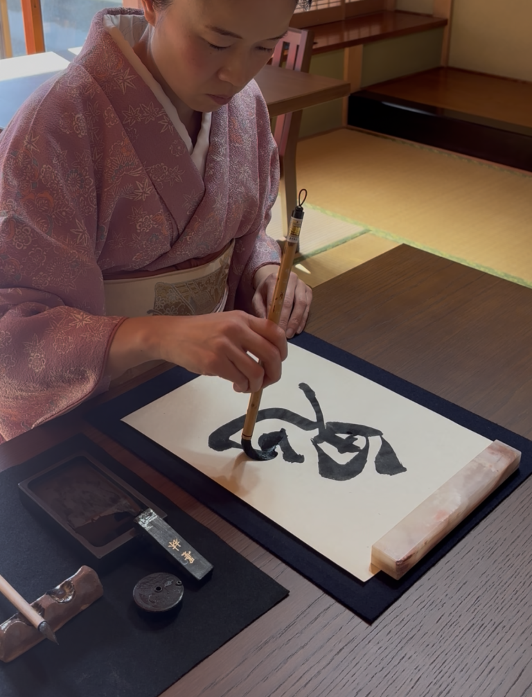 The owner writes the word "oni" in calligraphy.
